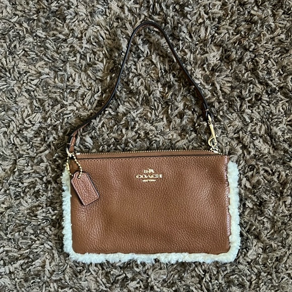 Coach Handbags - Coach Leather Shearling Mini Bag Ourse Wristlet